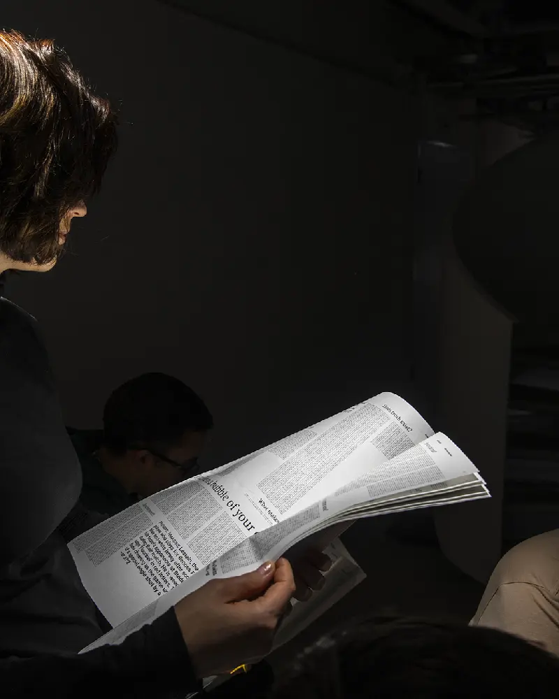 Beyond the Answer Person reading newspaper